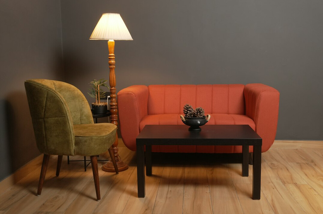 Interview set with two armchairs, a coffee table and soft studio lighting