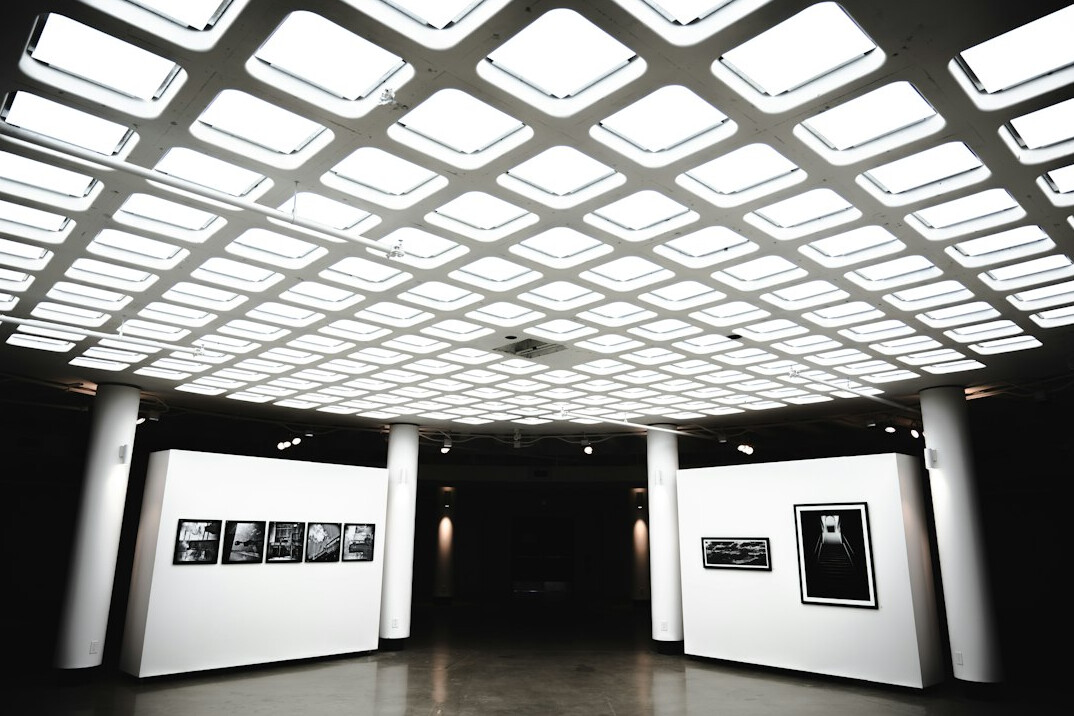 Overhead lighting grid with LED panels and softboxes above a studio set
